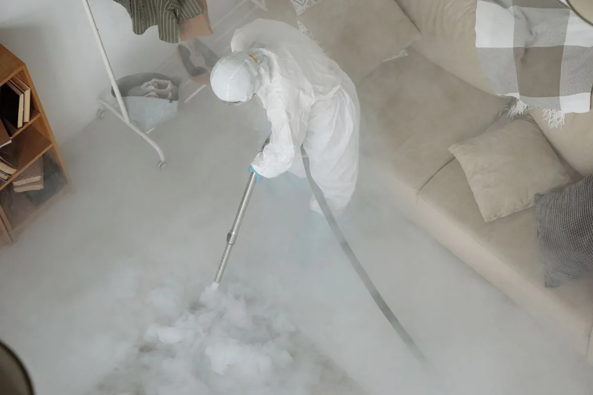 Biohazard cleanup technician in protective equipment, Golf Manor, OH